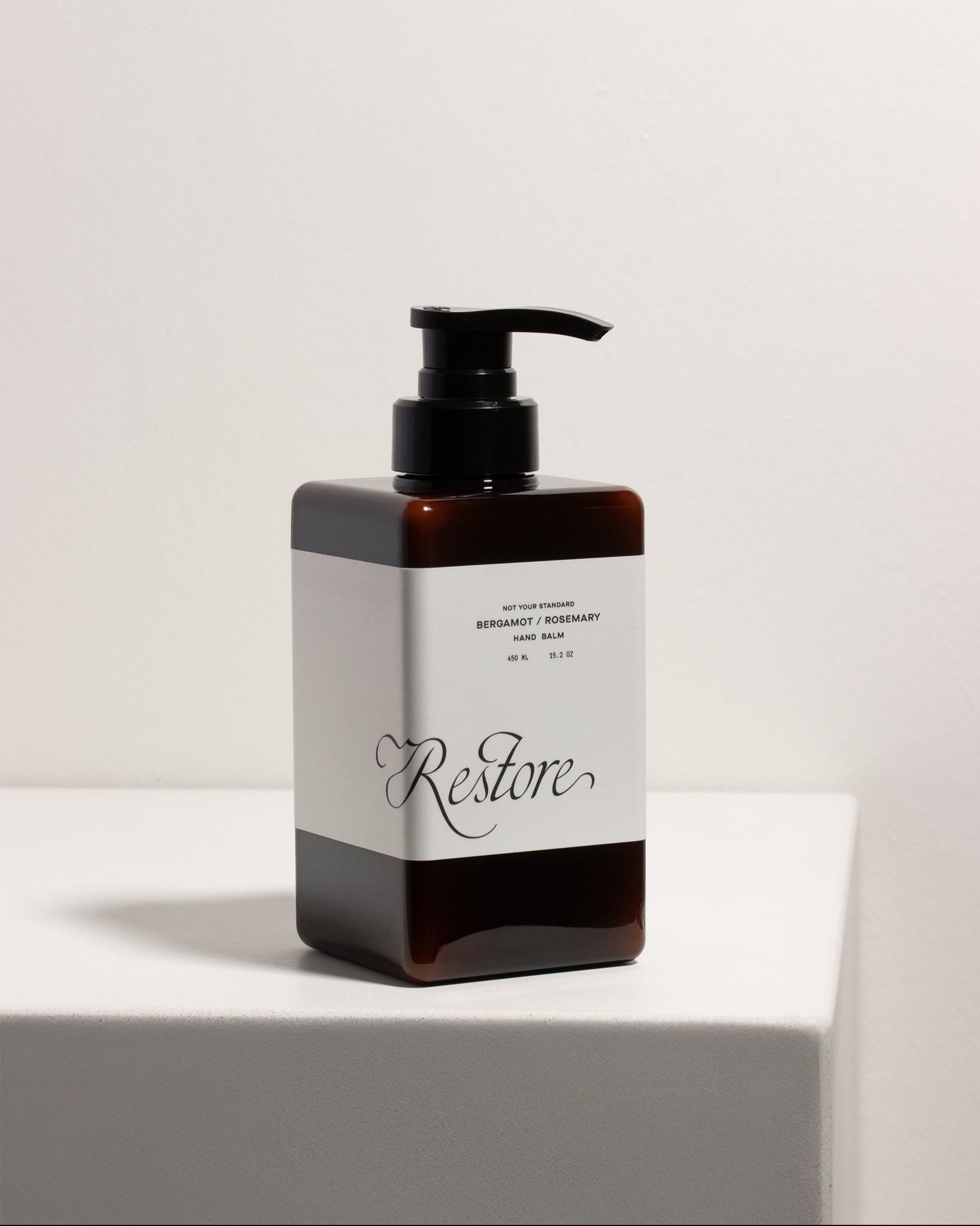 Not Your Standard Restore Hand Balm bottle front view with elegant minimal design